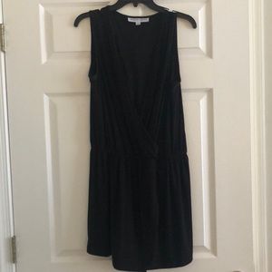 Brand new black low cut romper with skirt front.